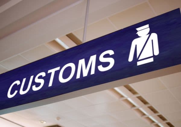 Overhead customs sign at a port terminal